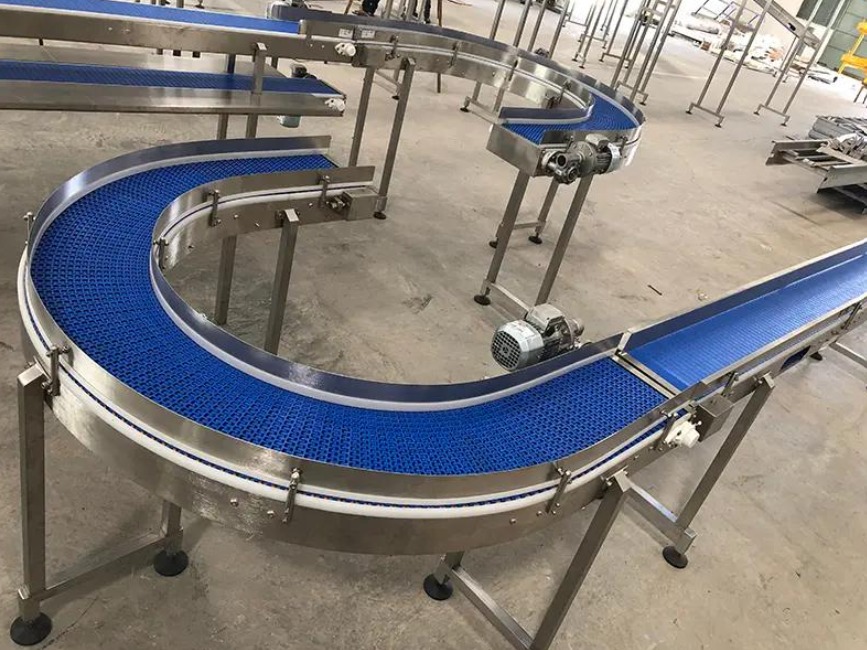 Blue modular conveyor belt system in an industrial facility